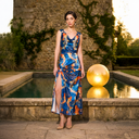 Blue cowl-neck maxi dress — resort dressing for a winter-sun escape.